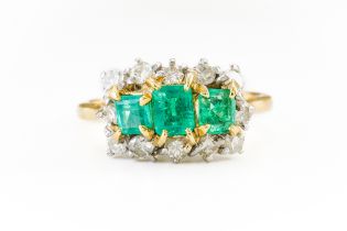 AN EMERALD AND DIAMOND RING