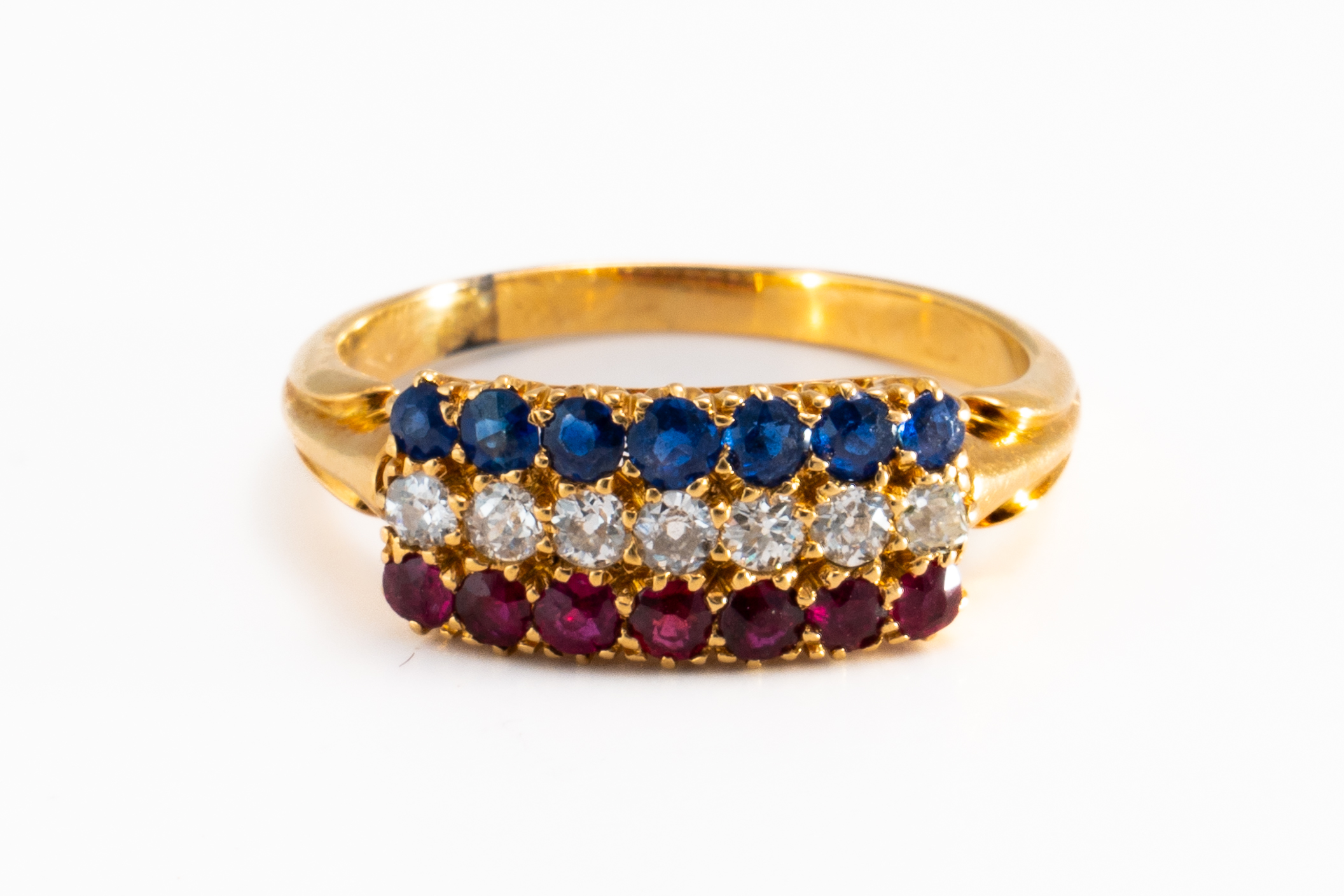 A DIAMOND, RUBY AND SAPPHIRE RING