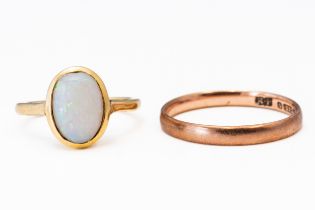 A SINGLE STONE OPAL RING AND A WEDDING BAND (2)
