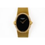 PATEK PHILIPPE 4332 LADIES GOLD WATCH WITH ONYX DIAL