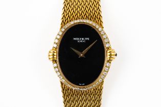PATEK PHILIPPE 4332 LADIES GOLD WATCH WITH ONYX DIAL