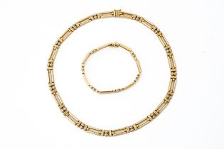 A MATCHING 9CT NECKLACE AND BRACELET