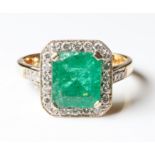 AN 18CT GOLD, EMERALD AND DIAMOND RING