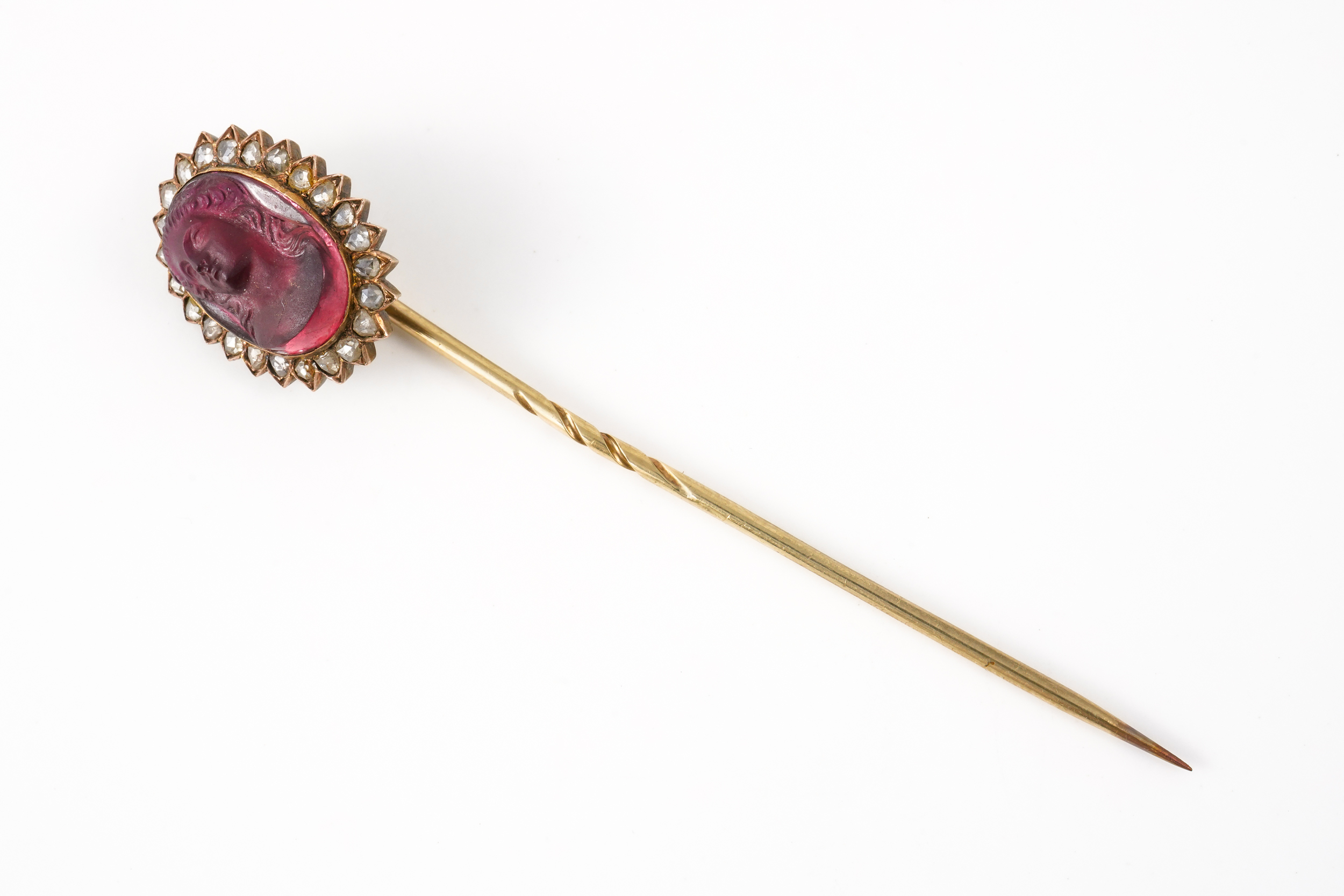 A GARNET AND DIAMOND STICK PIN