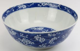 A Chinese blue and white porcelain bowl, probably 19th century. Decorated with blossoming prunus.