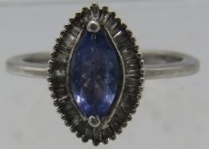 A 925 marked silver ring with marquise cut tanzanite & baguette diamonds, size N. Approx weight 2.