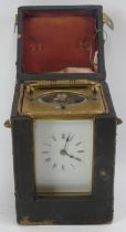 A gilt brass carriage clock, late 19th/early 20th century. Housed within a black leather box.