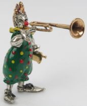 An Italian Sorini enamelled and parcel gilt sterling silver figure of a clown with trombone, 20th