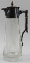 An electroplated silver mounted and cut glass decanter, late 19th/early 20th century. Modelled
