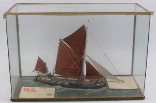 A cased maritime model of a ‘James Piper’ spritsail barge, dated 1986. With a silver medal award