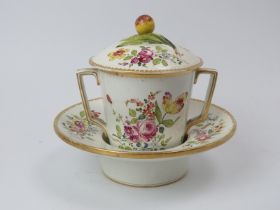A European trembleuse chocolate cup, cover and saucer, 19th century. Sometimes referred to as a