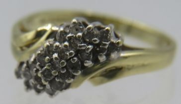 A 10ct yellow gold diamond cluster ring, size I. Approx weight 2.2 grams. Condition report: Slight