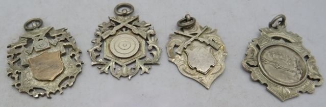 Four silver Rifle medallions all fully hallmarked to Pte. McGreadie, approx weight 42 grams.