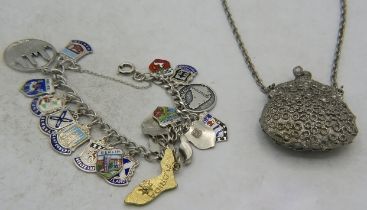 A collection of 19 mainly sterling silver enamelled shield charms on a white metal link bracelet and