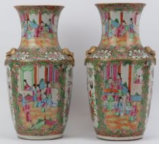 A pair of Chinese Famille Rose Medallion polychrome enamelled porcelain twin handled vases, mid-19th