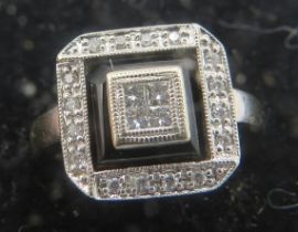 An 18ct white gold & black enamel Art Deco style ring set with 4 brilliant cut diamonds in centre