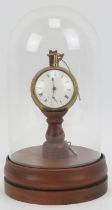 A Georgian pair cased gilt metal pocket watch housed in a domed glass pocket watch stand. With a