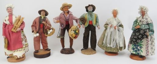 A group of six French provincial hand painted carved wood and plaster caricature figures, late