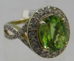 Peridot portrait set ring, size M, 14k yellow gold plated, stamped 925. Setting approx 16mm x