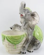 A large ceramic jardiniere modelled with an elephant, 20th century. 52 cm height. Condition