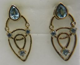Bezel set pear cut Ratanakiri blue zircon earrings, 30mm drop, post back. 14k yellow gold plated,