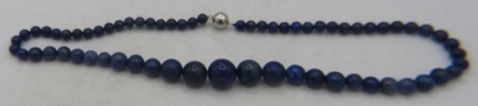 Lapis lazuli single strand necklace, 20" length. Largest graduated bead 16mm, magnetic clasp.