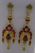 African ruby solitaire earrings with inset red enamelling, 50mm drop. 14k yellow gold plated,