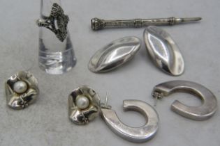 A silver marcasite ring, size K, a pair of 925 marked silver hoop earrings, a pair of 925 marked