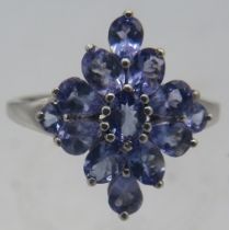 A 925 marked silver tanzanite ring set with 14 tanzanite, size O. Approx weight 1.8 grams. Condition