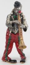 An Italian Sorini enamelled and parcel gilt silver figure of a clown with soprano saxophone, 20th