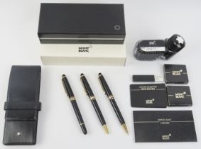 A Montblanc Meisterstück gilt and black matching fountain pen, ballpoint pen and propelling