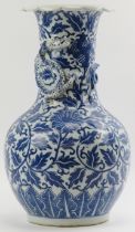 A Chinese blue and white porcelain dragon vase, 19th century. Decorated with a dragon modelled in