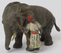 A rare German cold painted lead figure of an Indian huntsman with elephant, early 20th century.