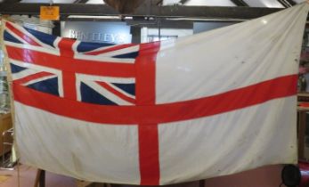 A large British Royal Navy ‘White Ensign’ flag, possibly WWII period. 130 cm x 285 cm. Condition