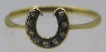 An 18ct yellow gold horseshoe shaped ring set with nine small diamonds, size Q, boxed. Approx weight