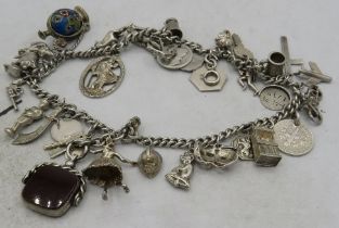 Two possibly silver link bracelets joined together with a large amount of silver & white metal