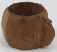 A Robert Thompson of Kilburn 'Mouseman' octagonal oak napkin ring with mouse carved in relief. 3.7