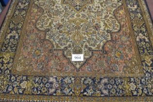 A central Persian Isfahan carpet central floral motif cream, red, blue, with wide borders. In good