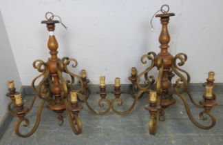 A pair of vintage Continental fruitwood and gilt metal six branch chandeliers. H70cm Diameter
