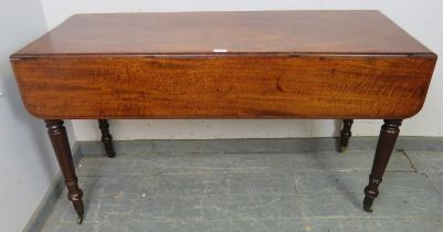 An early 19th century mahogany Pembroke table of exceptionally long proportions, having single