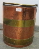 An Arts & Crafts Period planished copper coal/log bucket, with brass coopered and riveted banding