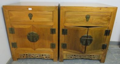 A pair of vintage light elm Chinese side cabinets, each with one long drawer above double doors with