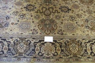 A late 20th century Indian pure wool carpet. Central block pattern of foliage on a deep cream