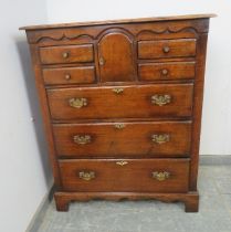 A good quality solid oak chest by Titchmarsh & Goodwin in the 18th century taste, the shaped