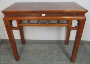 A vintage Chinese elm altar table in the 18th century style, having carved and pierced fretwork