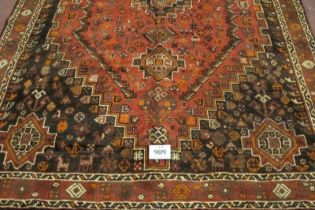 A fine South West Persian Qashqai carpet central motif with 2 smaller each end. Good strong colours.