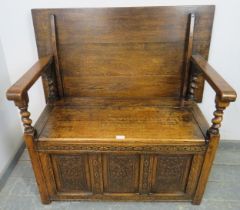 A good quality medium oak monk’s bench in the 17th century taste, having a sliding backrest joined