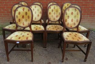A set of 10 19th century mahogany dining chairs, upholstered in gold patterned material with braid