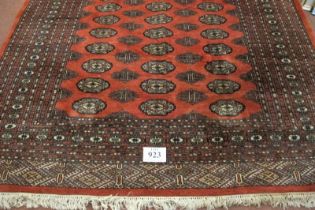 A mid-late 20th century Persian carpet. Central block repeat pattern on red ground, with an extra