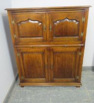A good quality 18th century style solid oak drinks cabinet in manner of Titchmarsh & Goodwin, the